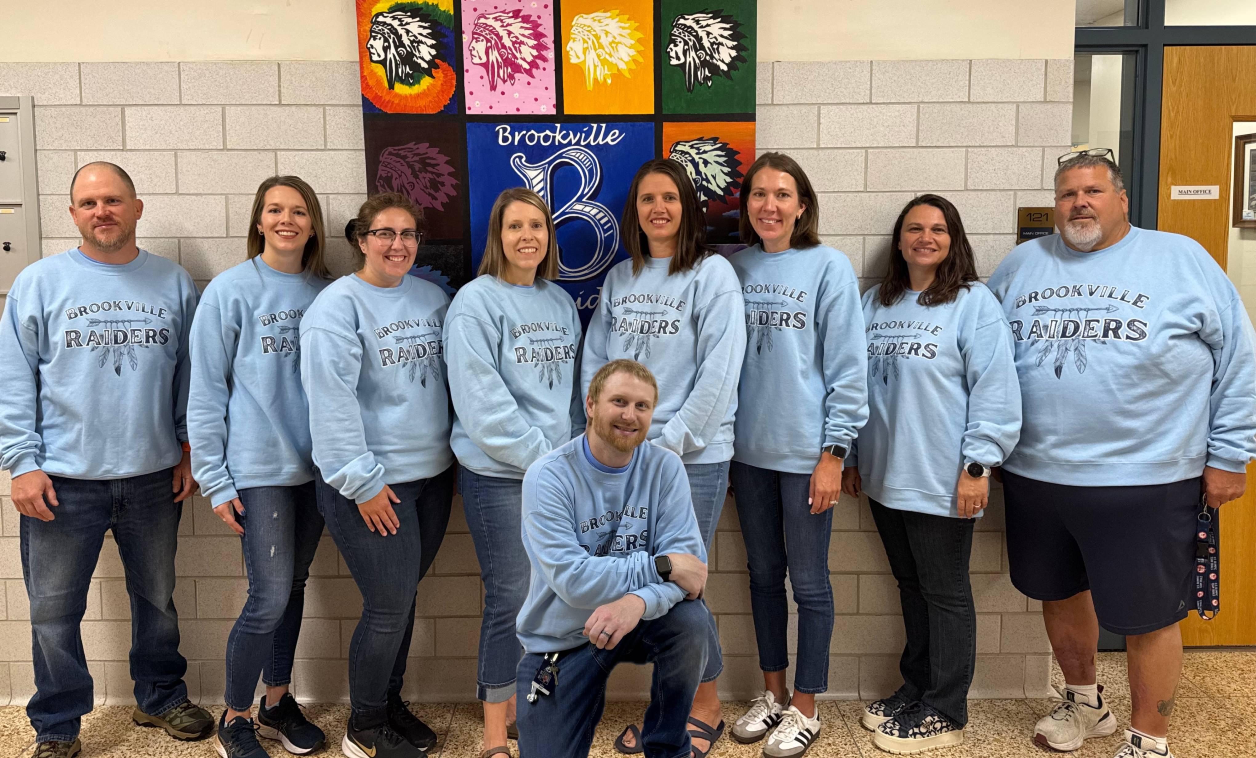 Senior hall faculty members pose for a photo on Twin Day during spirit week.